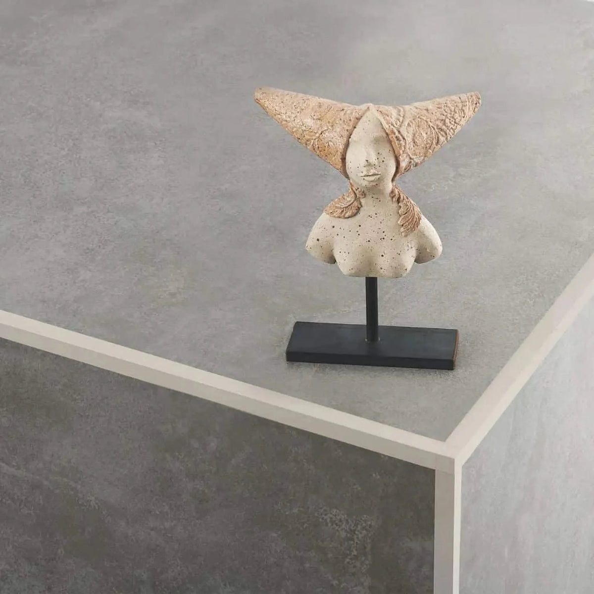 Sand-coloured powder-coated square profile made of aluminium installed on the outside corner under dark tile covering.