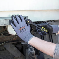 Example image of the Triuso Grip Plus gloves in use during a repair