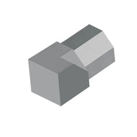 Zbliżenie diamentowego narożnika wewnętrznego DURAL do profilu diamentowego z aluminium w kolorze szarym betonowym.
