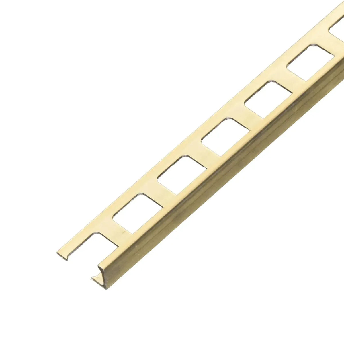 Close-up of a golden natural brass profile with square punching