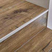 Installed Squarestep aluminium step profile on staircase with wood covering